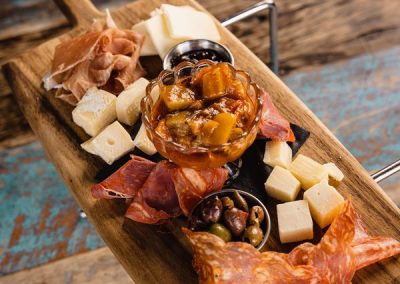 alt=" A italian charcuterie board with spicy pepperoni and mortadela, prosciutto and various cheeses"